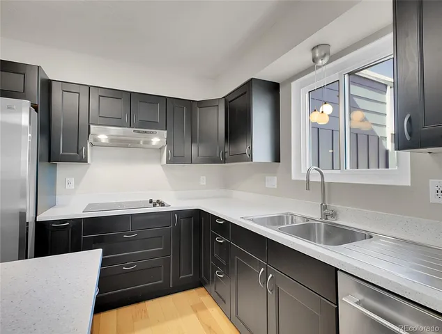 a kitchen with a sink and cabinets