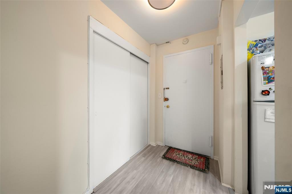 3040 Edwin Avenue, Unit 4A Fort Lee, NJ 07024 - Photo 3 of 15 a view of an entryway with wooden floor
