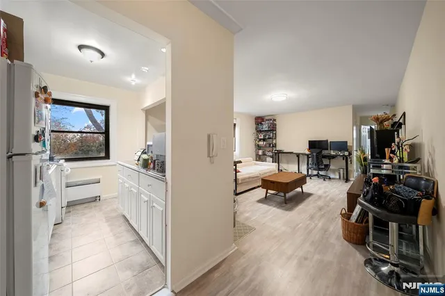a view of living room kitchen with furniture and a flat screen tv