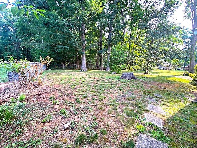 647 Hodgin Valley Road Pleasant Garden, NC 27313 - Photo 22 of 24 Spacious fenced backyard.