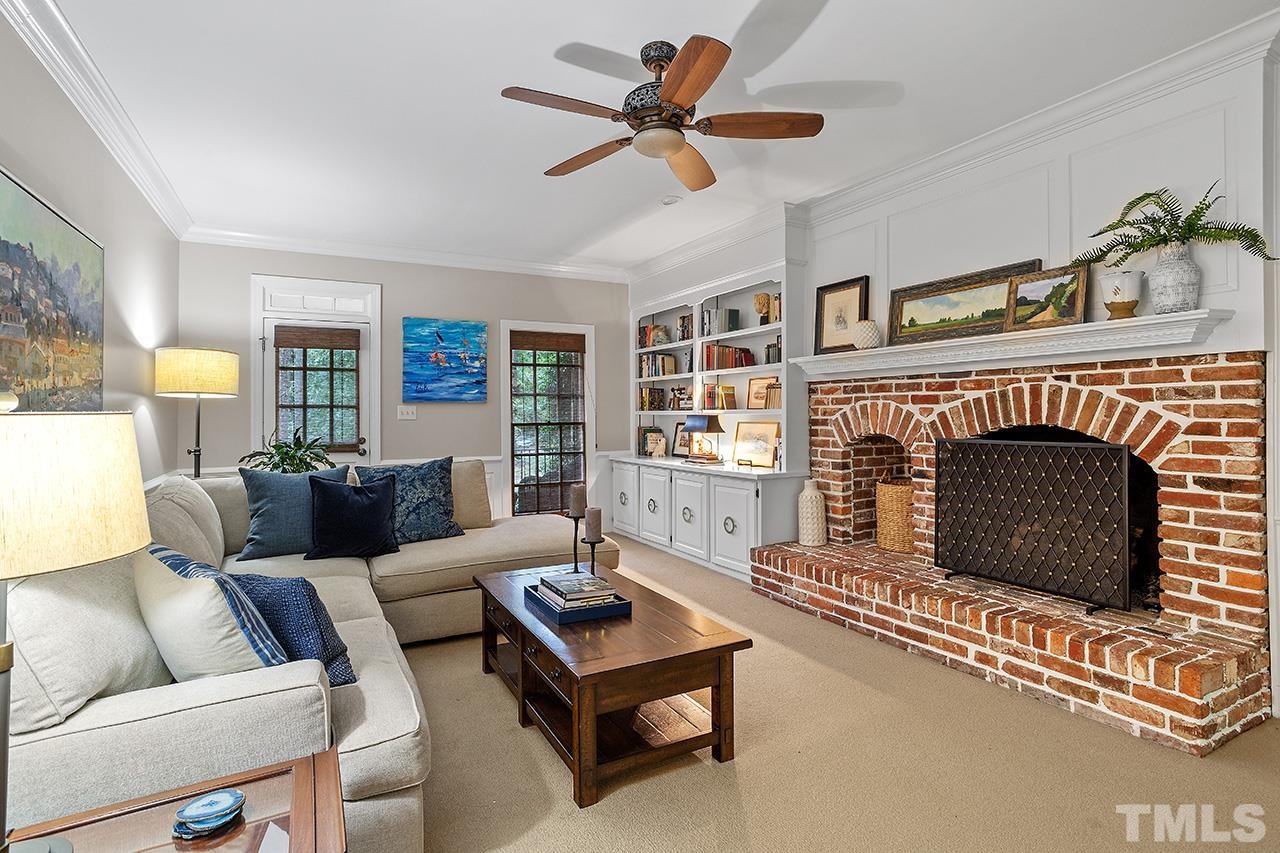 717 Presnell Court Raleigh, NC 27615 - Photo 16 of 36 a living room with furniture and a fireplace