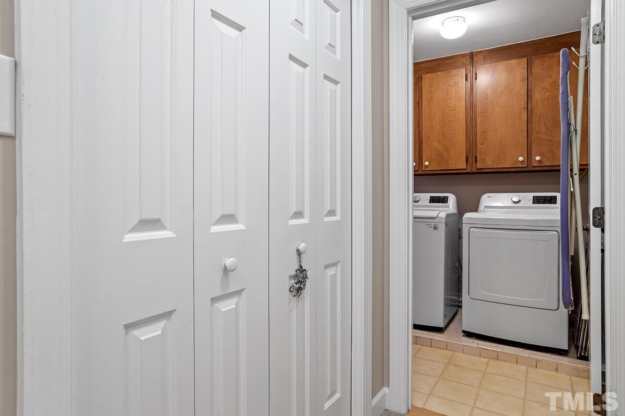 717 Presnell Court Raleigh, NC 27615 - Photo 29 of 36 a view of a utility room with washer and dryer
