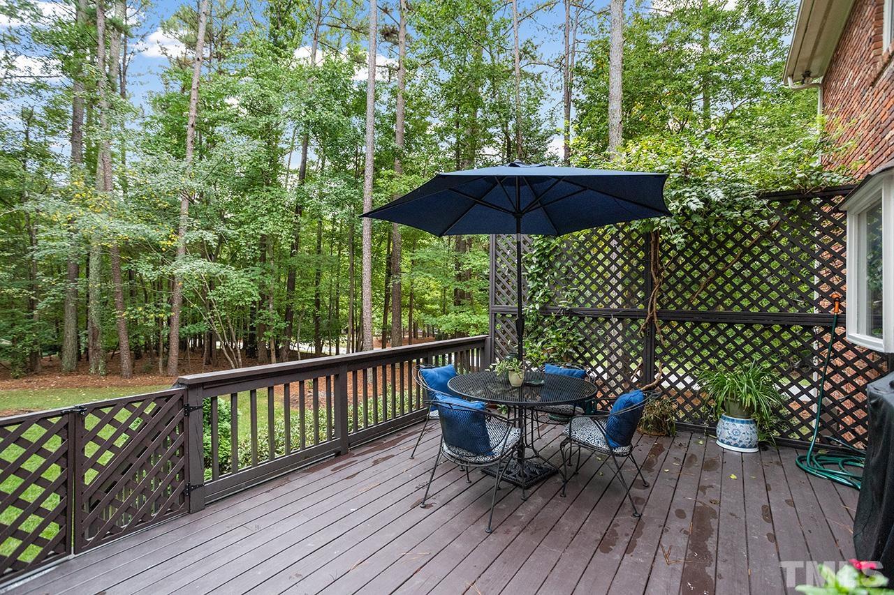 717 Presnell Court Raleigh, NC 27615 - Photo 33 of 36 a view of a deck with furniture and wooden floor