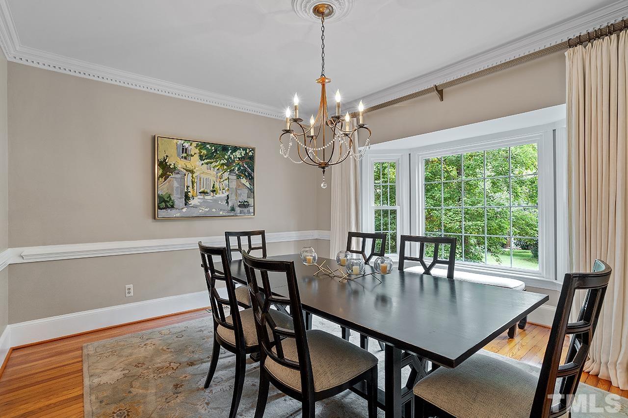 717 Presnell Court Raleigh, NC 27615 - Photo 8 of 36 a view of a dining room with furniture window and outside view