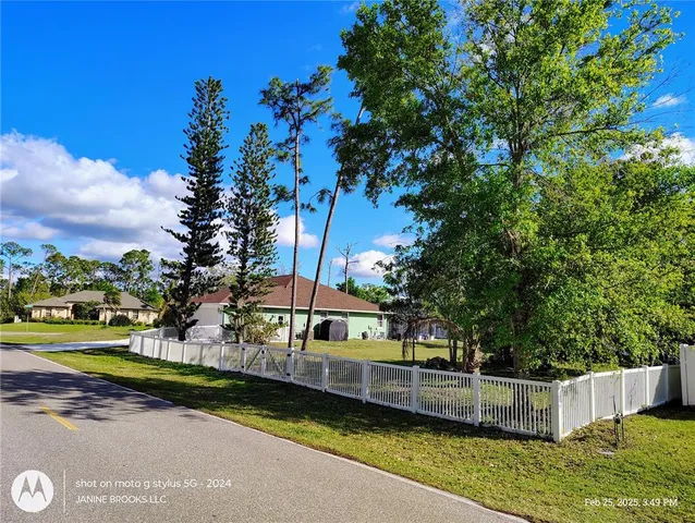 a view of street with houses and trees