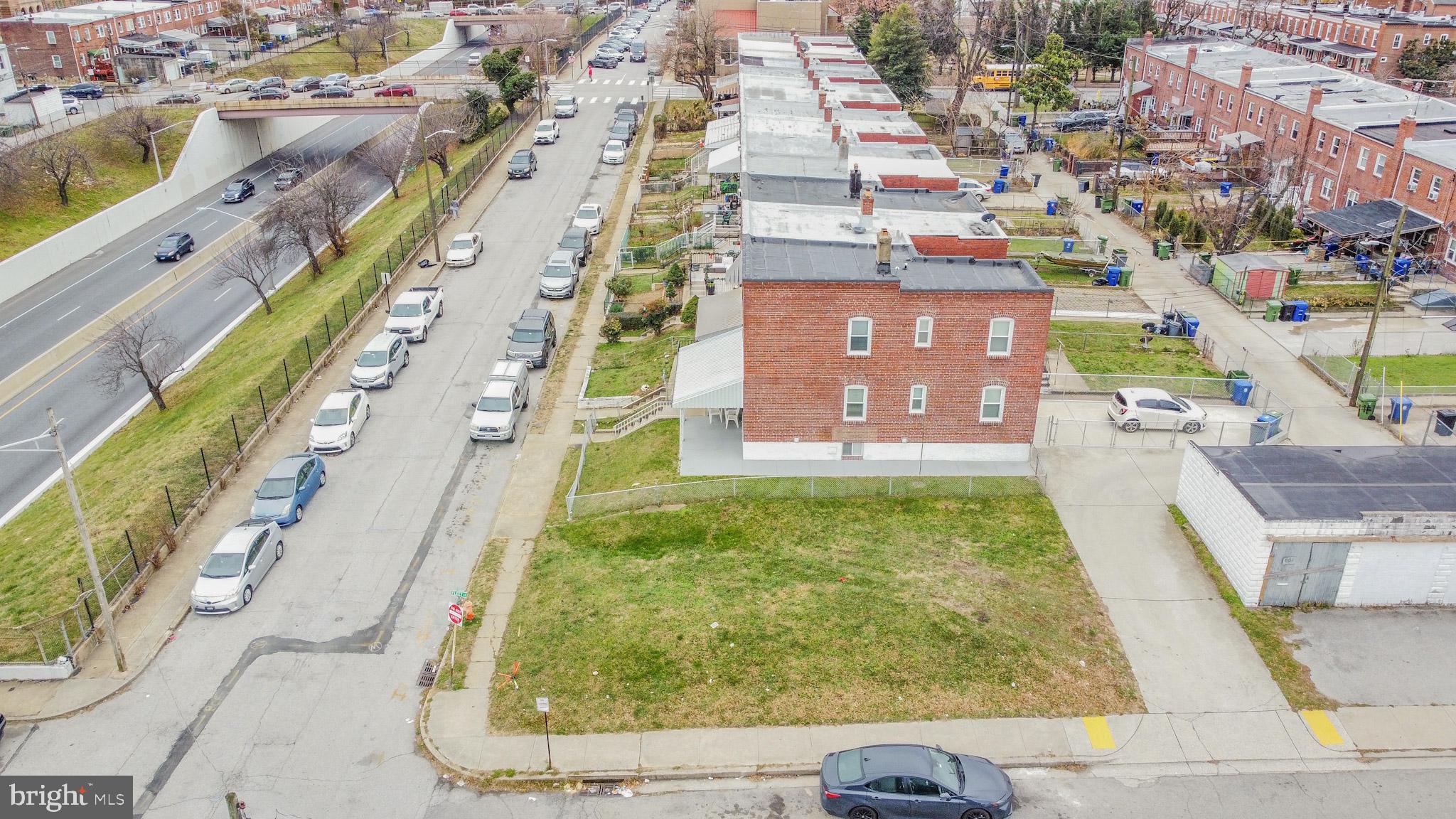 600 Quail Street Baltimore, MD 21224 - Photo 2 of 12 a aerial view of a residential apartment building with a yard