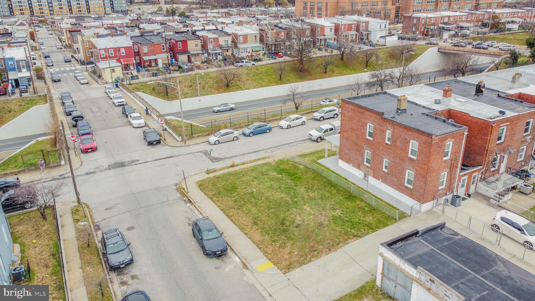 600 Quail Street Baltimore, MD 21224 - Photo 9 of 12 a view of an swimming pool with a lounge chairs