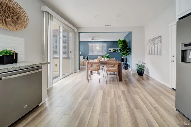 a view of a dining room with furniture window and wooden floor