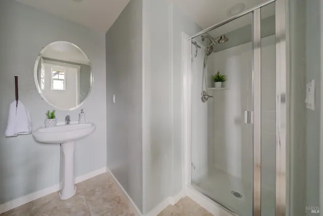 a bathroom with a sink and mirror
