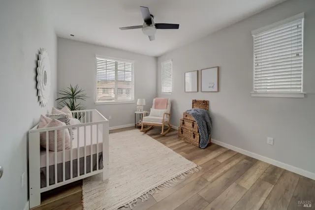 a bedroom with furniture and a window