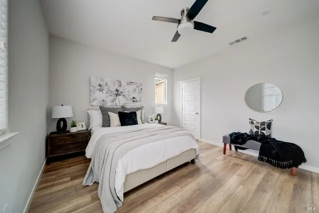 a bed room with a bed and a chandelier