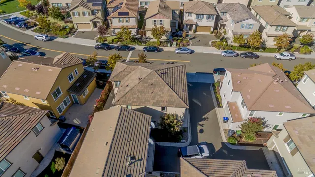 an aerial view of a houses with outdoor space