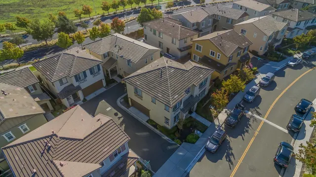 an aerial view of a house with a yard