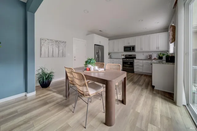 a kitchen with a table and chairs in it