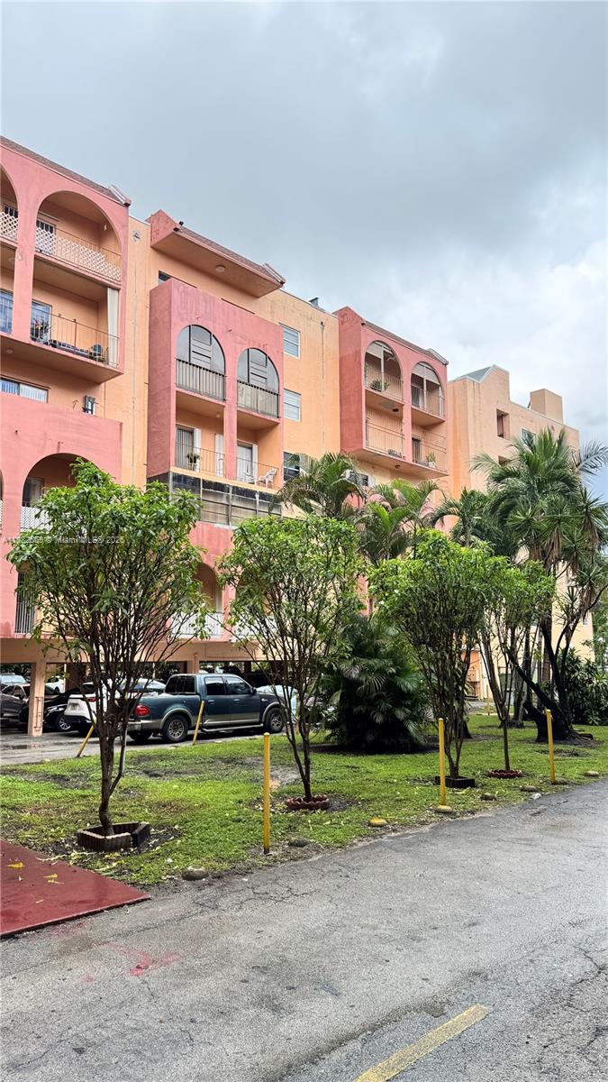 460 East 23rd Street, Unit 103 Hialeah, FL 33013 - Photo 1 of 20 a front view of a building with tree s