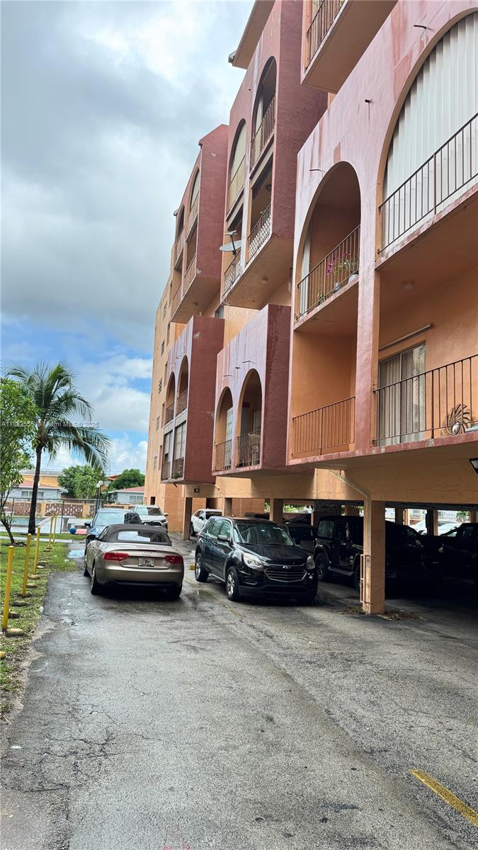 460 East 23rd Street, Unit 103 Hialeah, FL 33013 - Photo 20 of 20 a car parked in front of a building