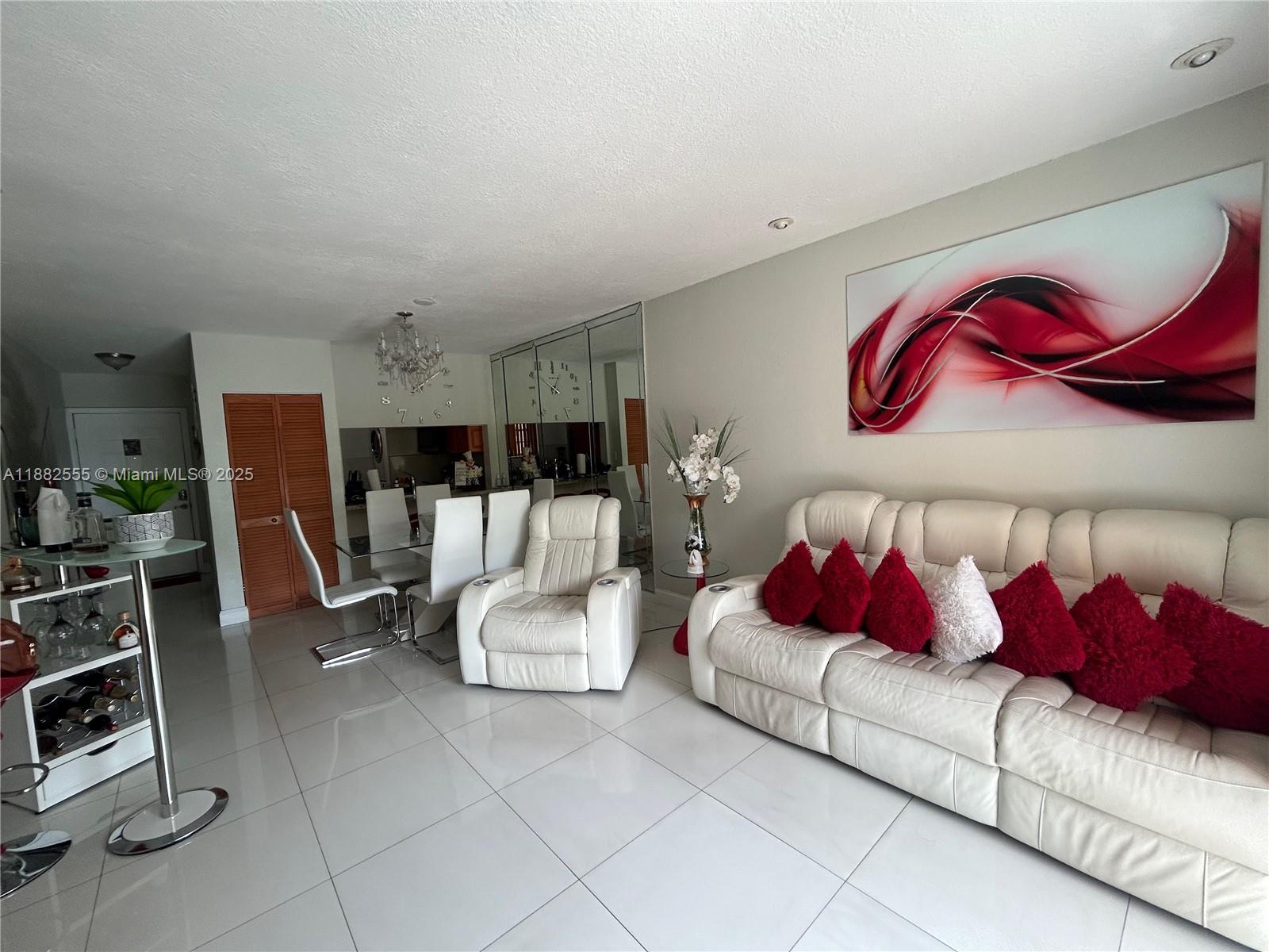 460 East 23rd Street, Unit 103 Hialeah, FL 33013 - Photo 3 of 20 a living room with furniture