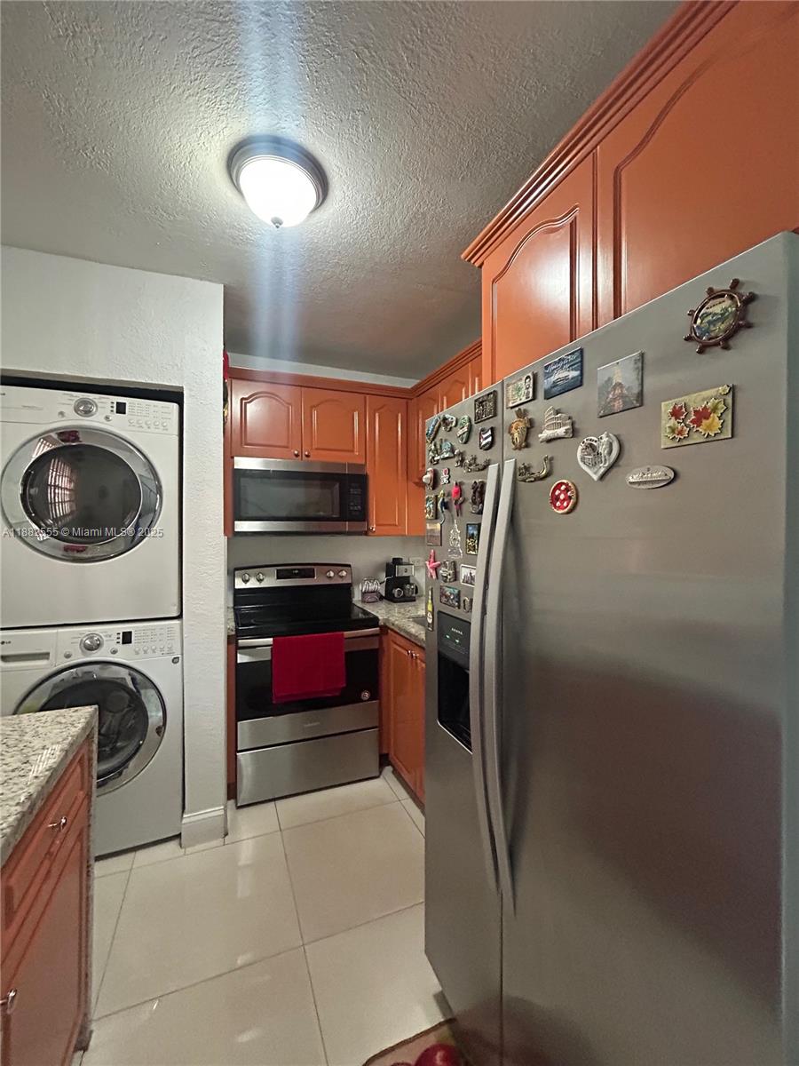 460 East 23rd Street, Unit 103 Hialeah, FL 33013 - Photo 6 of 20 a view of a refrigerator in a kitchen