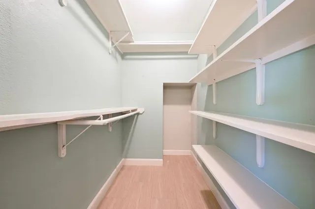 a view of an empty walk in closet