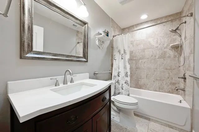 a bathroom with a sink a toilet and a bathtub
