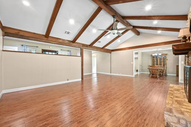 a view of a livingroom with wooden floor