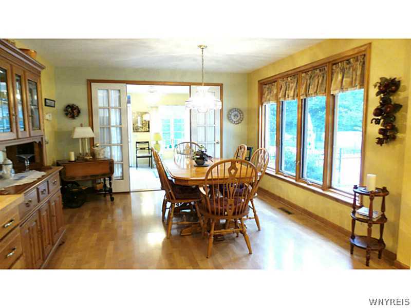 4109 Beach Ridge Road Pendleton, NY 14120 - Photo 3 of 25 Kitchen Dining. The dining area leads into the sun