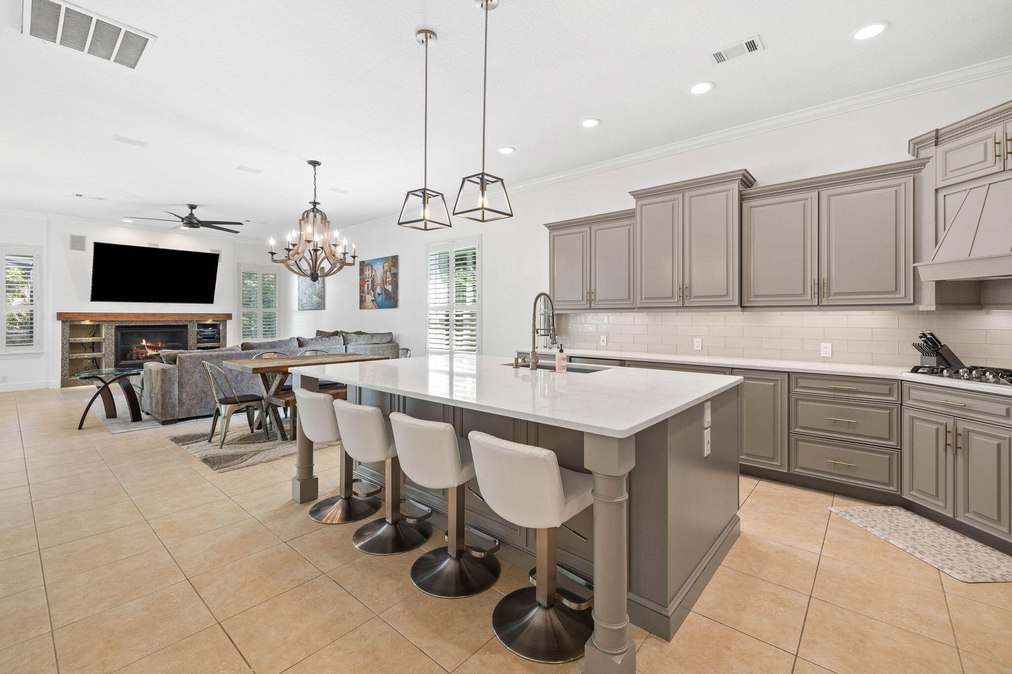 201 Mattie's Way Destin, FL 32541 - Photo 11 of 61 a kitchen with a sink and chairs