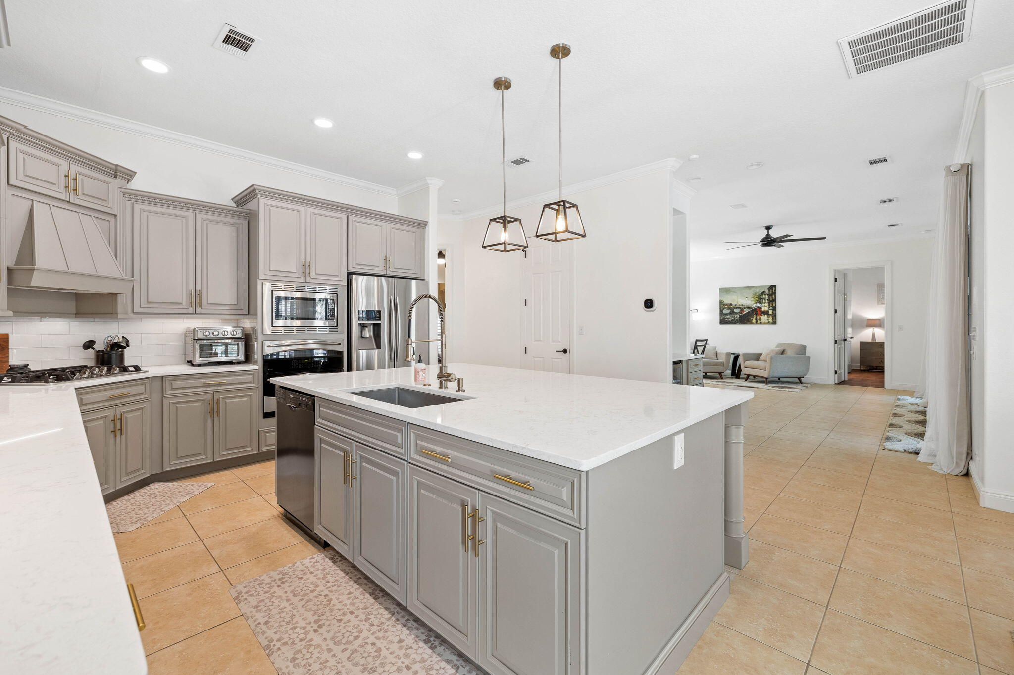 201 Mattie's Way Destin, FL 32541 - Photo 13 of 61 a kitchen with stainless steel appliances a stove refrigerator sink and cabinets