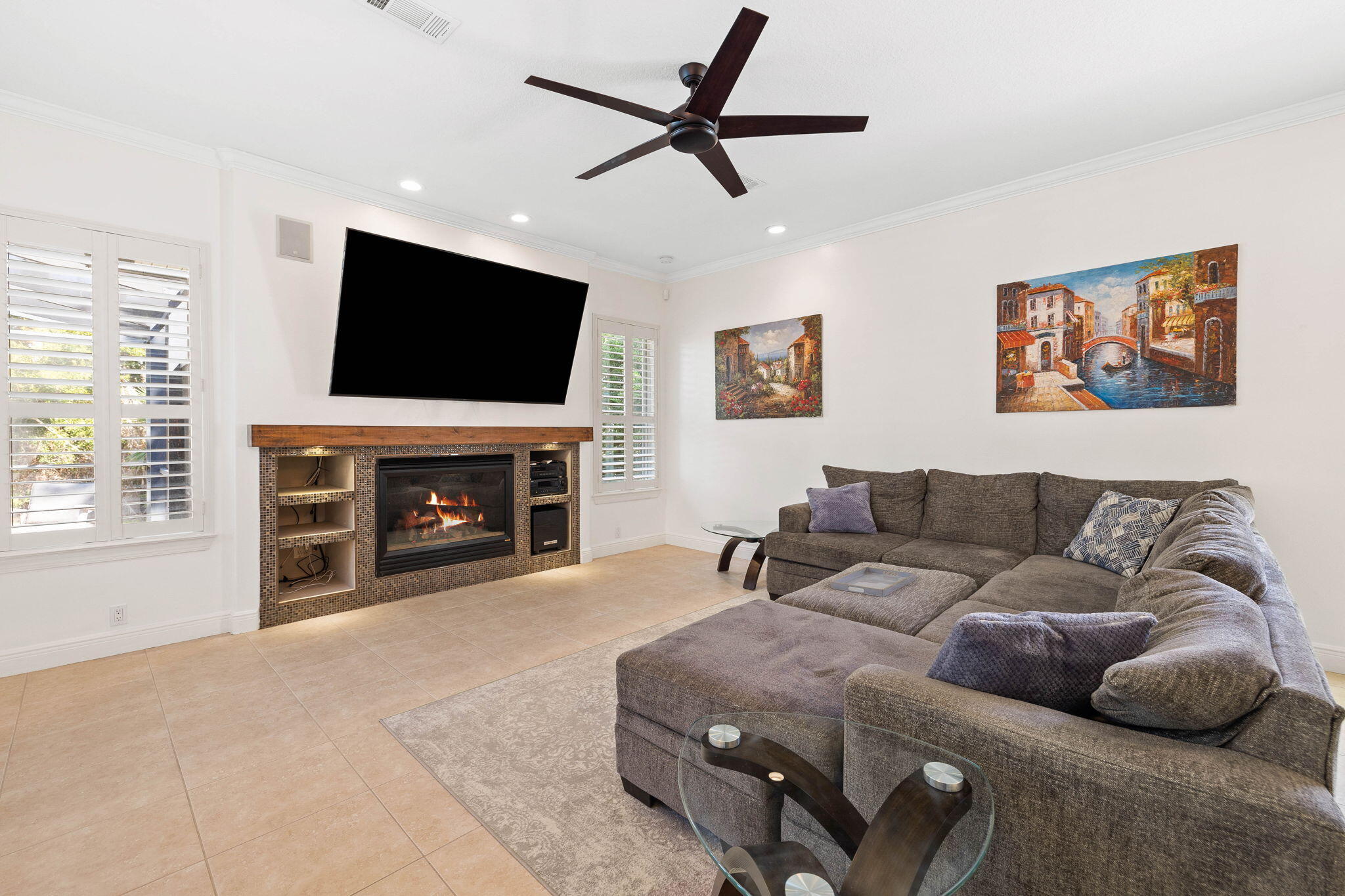 201 Mattie's Way Destin, FL 32541 - Photo 16 of 61 a living room with furniture a flat screen tv and a fireplace