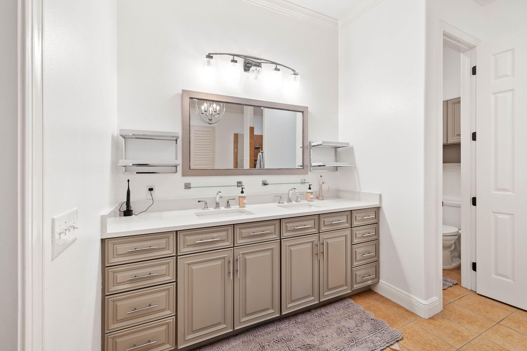 201 Mattie's Way Destin, FL 32541 - Photo 22 of 61 a bathroom with a double vanity sink and mirror