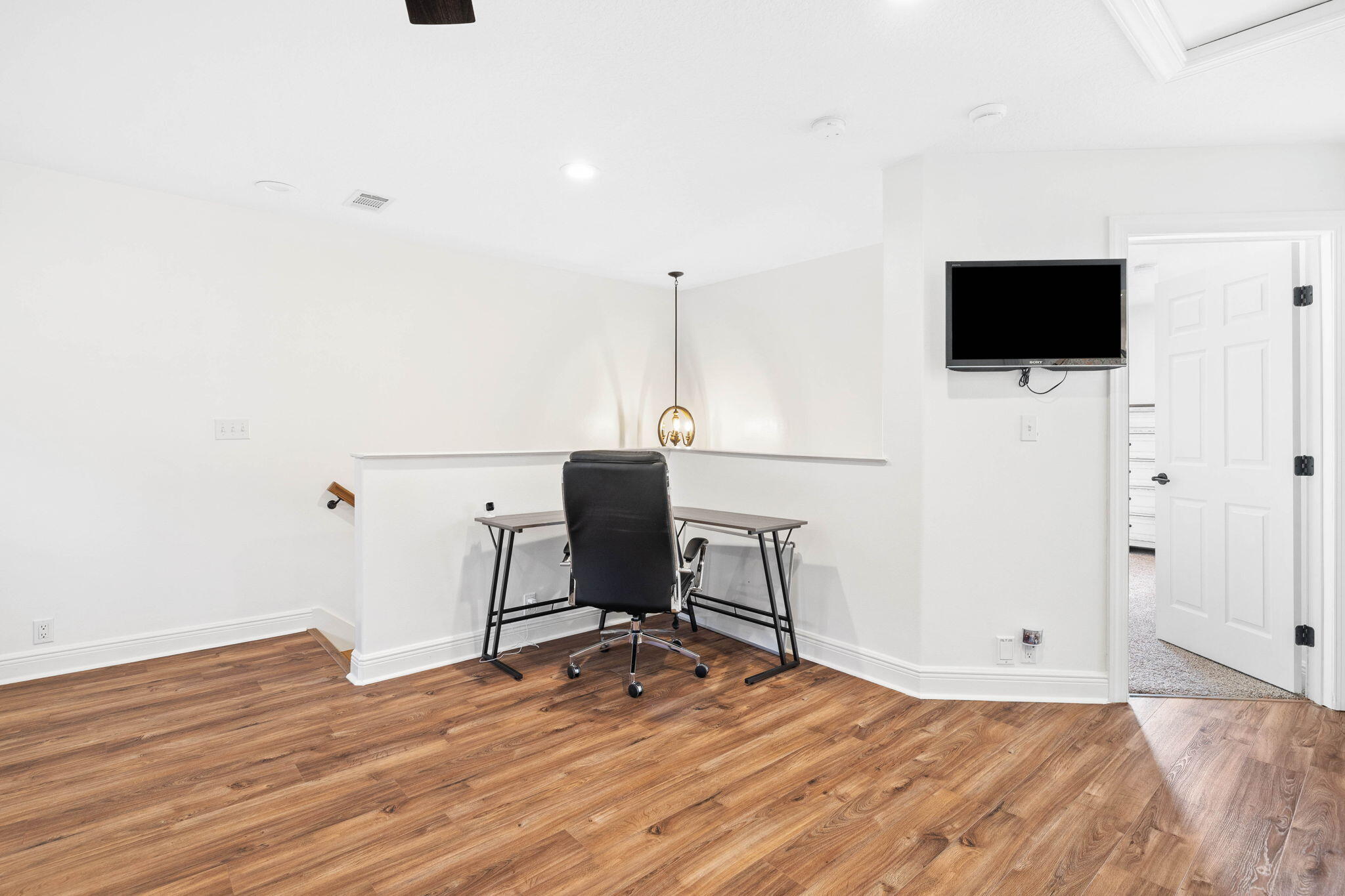 201 Mattie's Way Destin, FL 32541 - Photo 27 of 61 a view of a workspace with wooden floor