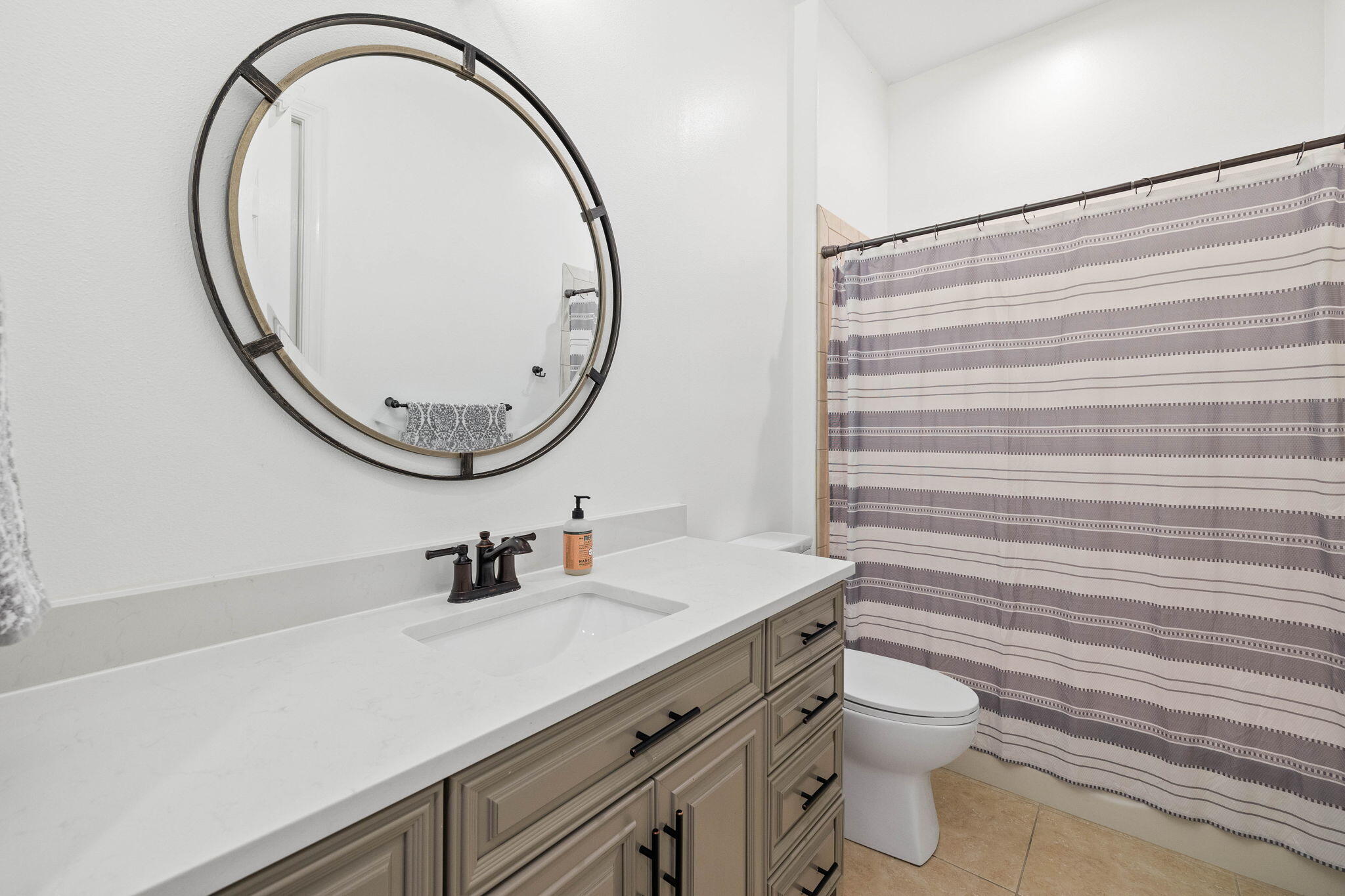 201 Mattie's Way Destin, FL 32541 - Photo 30 of 61 a bathroom with a sink a mirror and a toilet