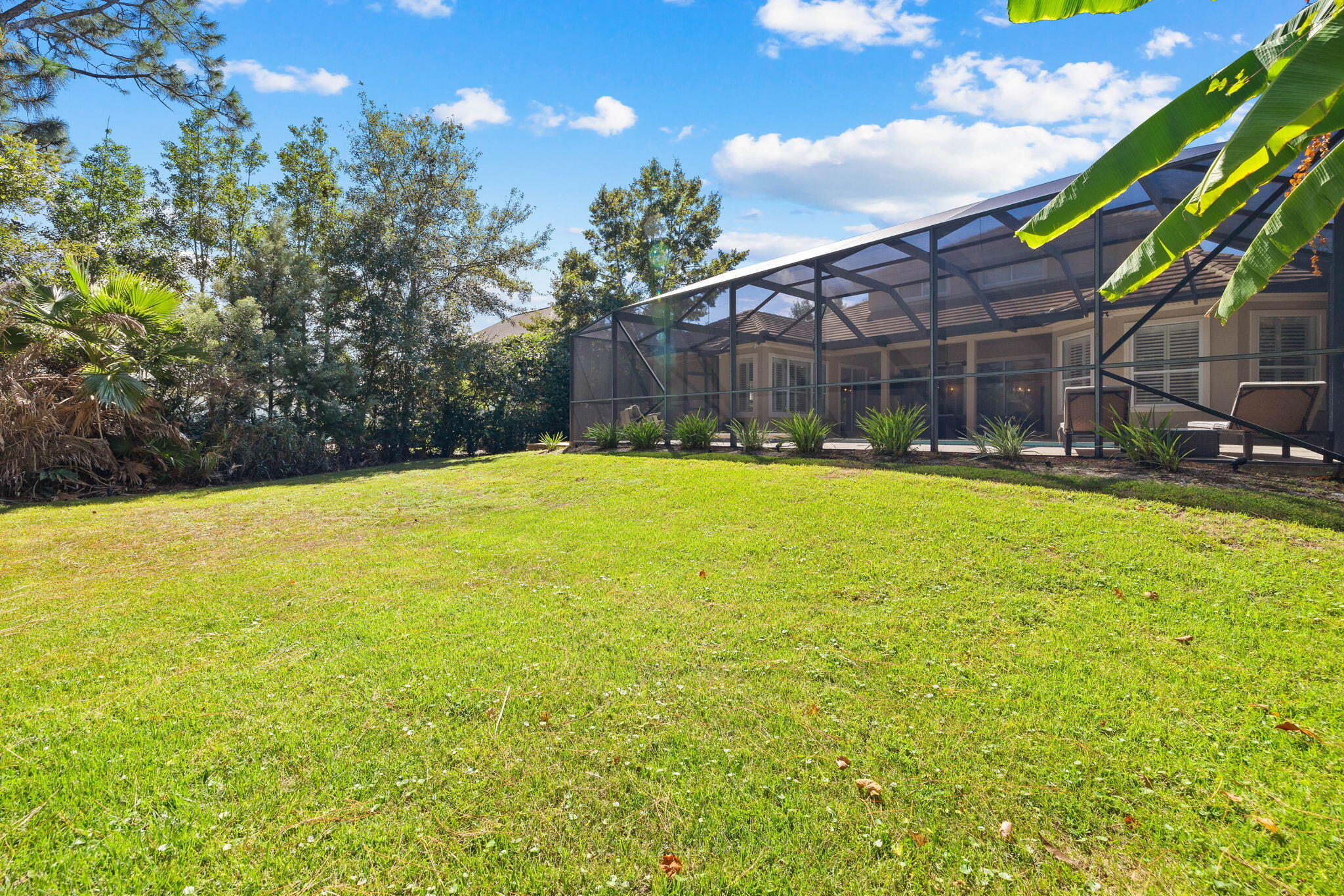 201 Mattie's Way Destin, FL 32541 - Photo 41 of 61 a swimming pool with outdoor seating and yard