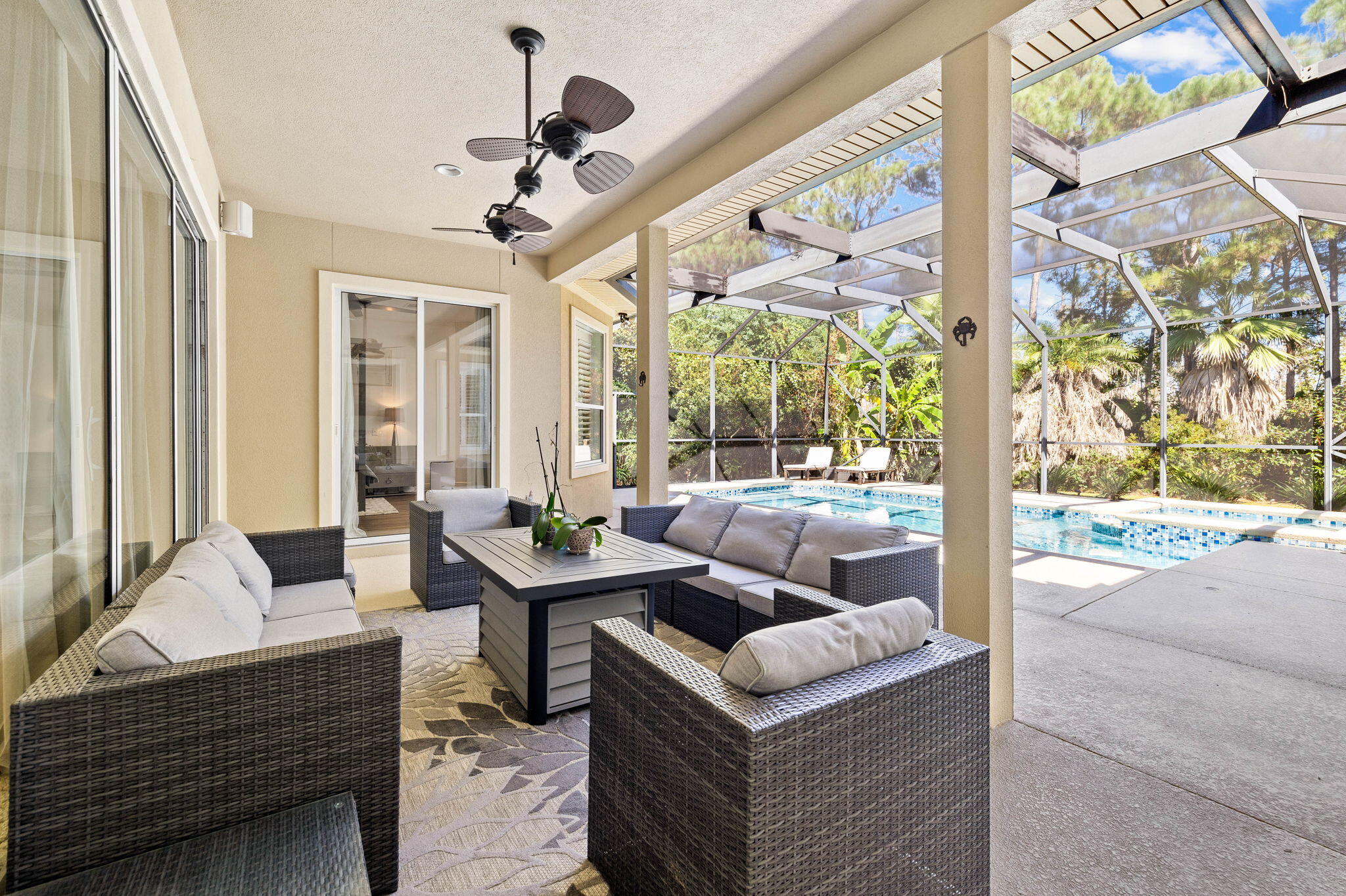 201 Mattie's Way Destin, FL 32541 - Photo 46 of 61 a living room with fireplace furniture and a chandelier
