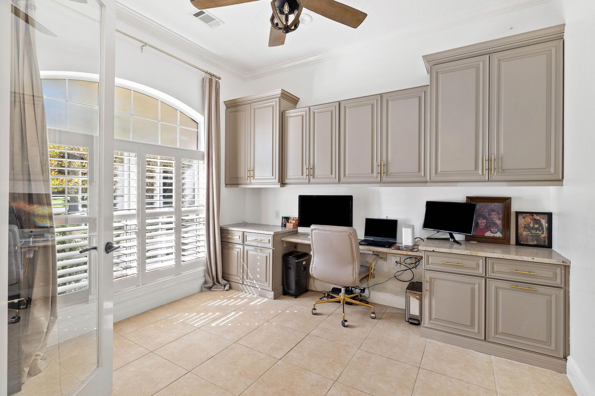 201 Mattie's Way Destin, FL 32541 - Photo 6 of 61 a view of a workspace with furniture and a window