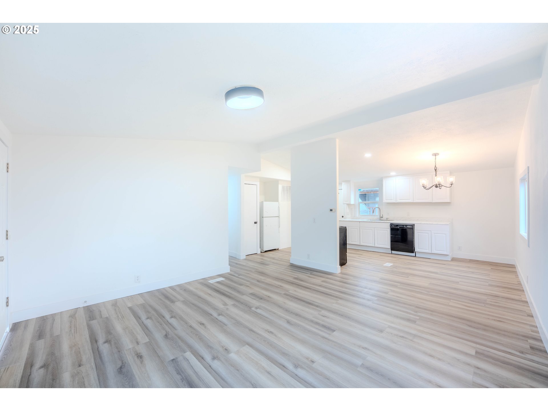 3370 Maple Street, Unit 44 Hubbard, OR 97032 - Photo 14 of 29 a view of a room with wooden floor and fireplace