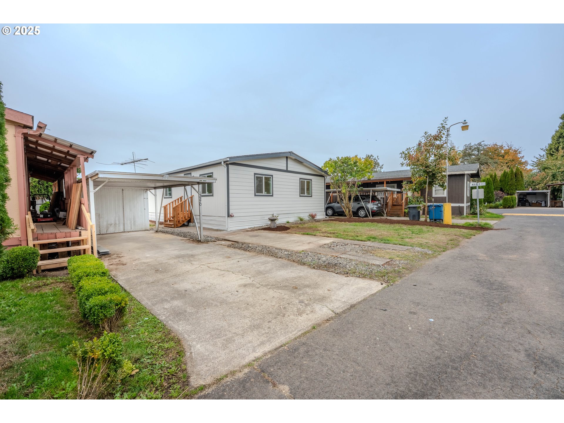 3370 Maple Street, Unit 44 Hubbard, OR 97032 - Photo 2 of 29 a view of a house with a yard