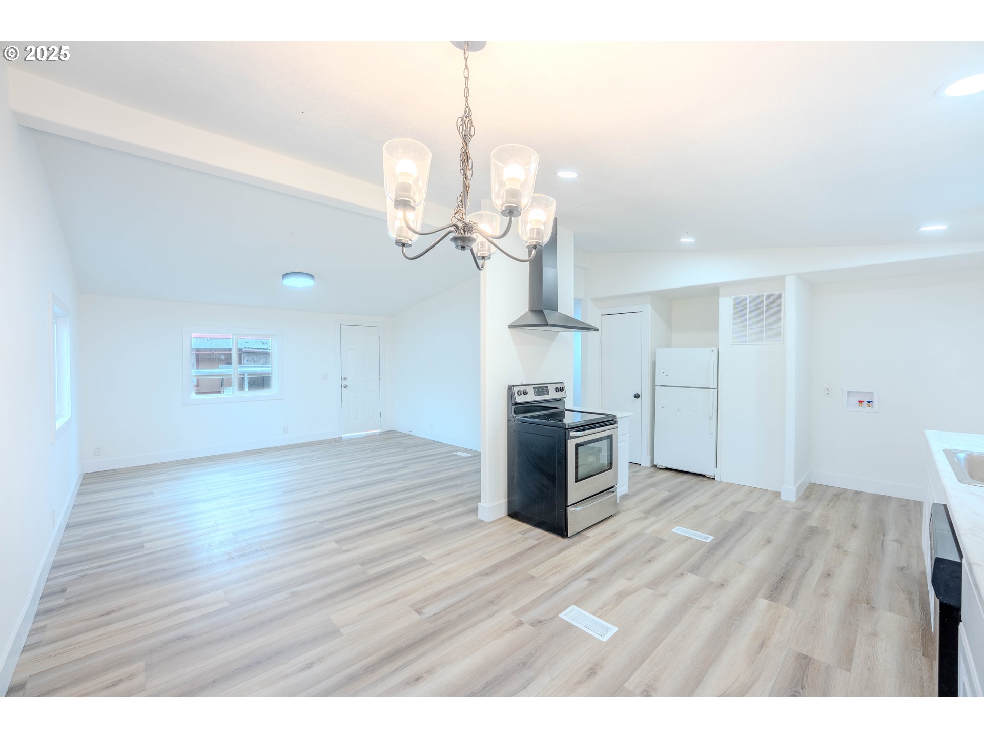 3370 Maple Street, Unit 44 Hubbard, OR 97032 - Photo 9 of 29 a view interior of kitchen and hall with wooden floor