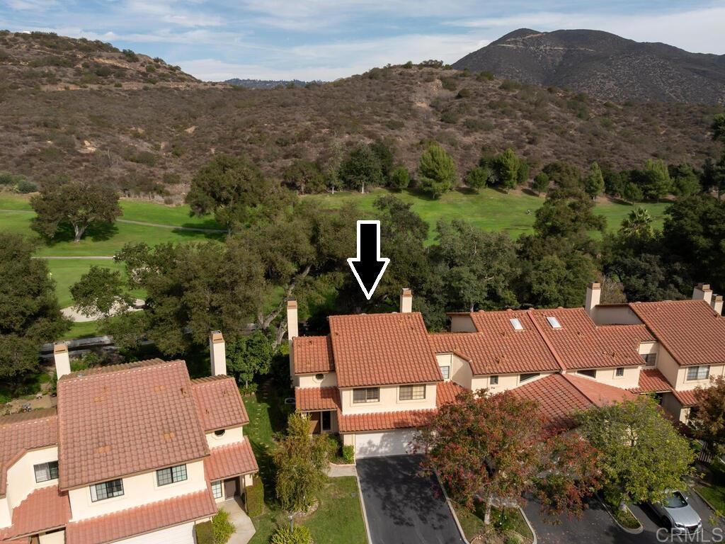 1718 Tecalote Drive, Unit 14 Fallbrook, CA 92028 - Photo 1 of 40 an aerial view of house with an outdoor space
