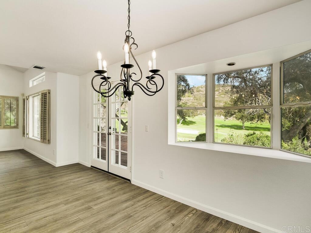 1718 Tecalote Drive, Unit 14 Fallbrook, CA 92028 - Photo 12 of 40 a view of a room with wooden floor fan and windows