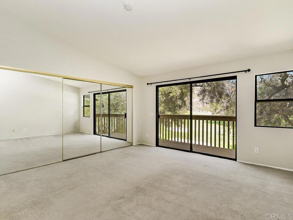 1718 Tecalote Drive, Unit 14 Fallbrook, CA 92028 - Photo 19 of 40 a view of a big room with windows and city view