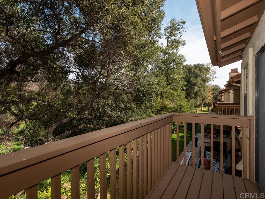 1718 Tecalote Drive, Unit 14 Fallbrook, CA 92028 - Photo 22 of 40 a view of balcony with wooden floor and fence