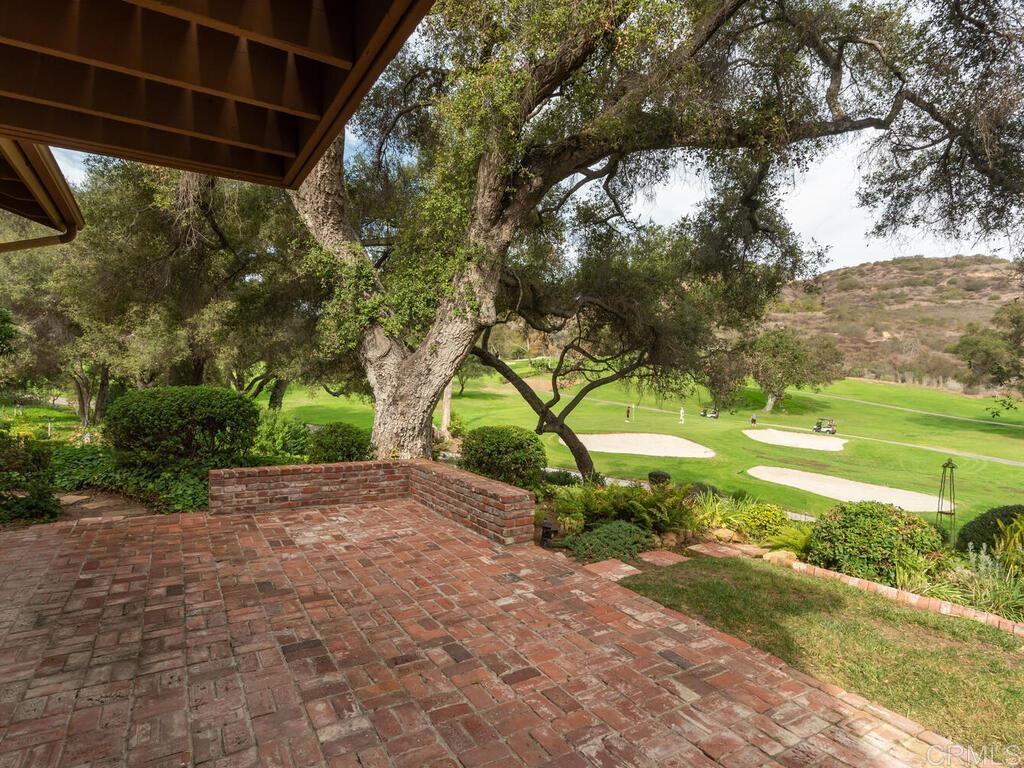 1718 Tecalote Drive, Unit 14 Fallbrook, CA 92028 - Photo 30 of 40 a backyard of a house with a yard and outdoor seating