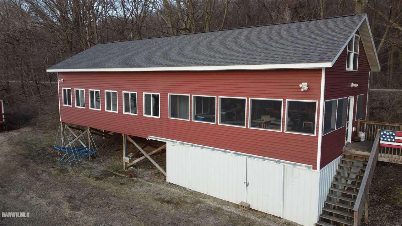 5476 South River Road Hanover, IL 61041 - Photo 1 of 17 a view of a house with backyard and porch