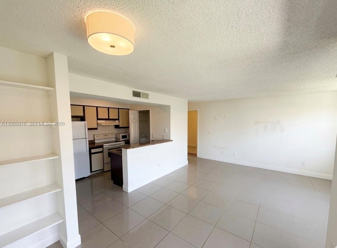1253 Southwest 46th Avenue, Unit 1608 Pompano Beach, FL 33069 - Photo 6 of 14 a view of a kitchen