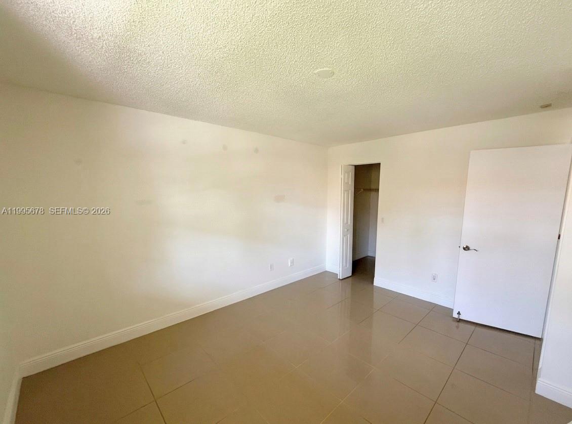 1253 Southwest 46th Avenue, Unit 1608 Pompano Beach, FL 33069 - Photo 9 of 14 a view of an empty room