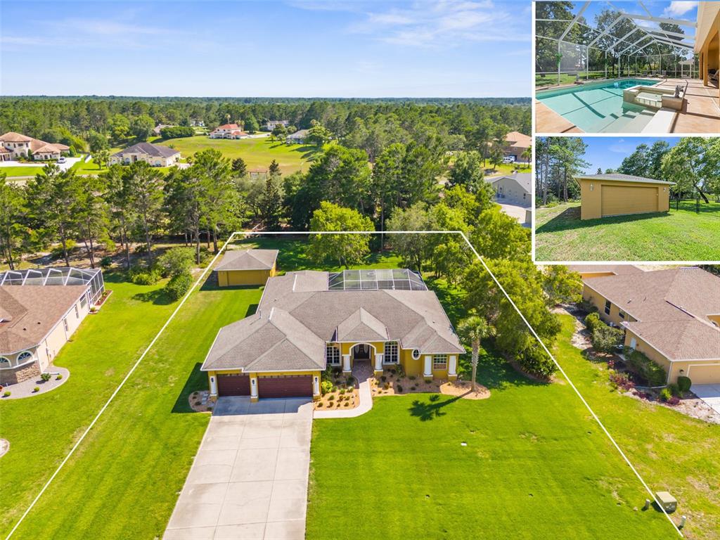 10148 Whisper Ridge Trail Weeki Wachee, FL 34613 - Photo 1 of 1 an aerial view of residential houses with outdoor space and swimming pool