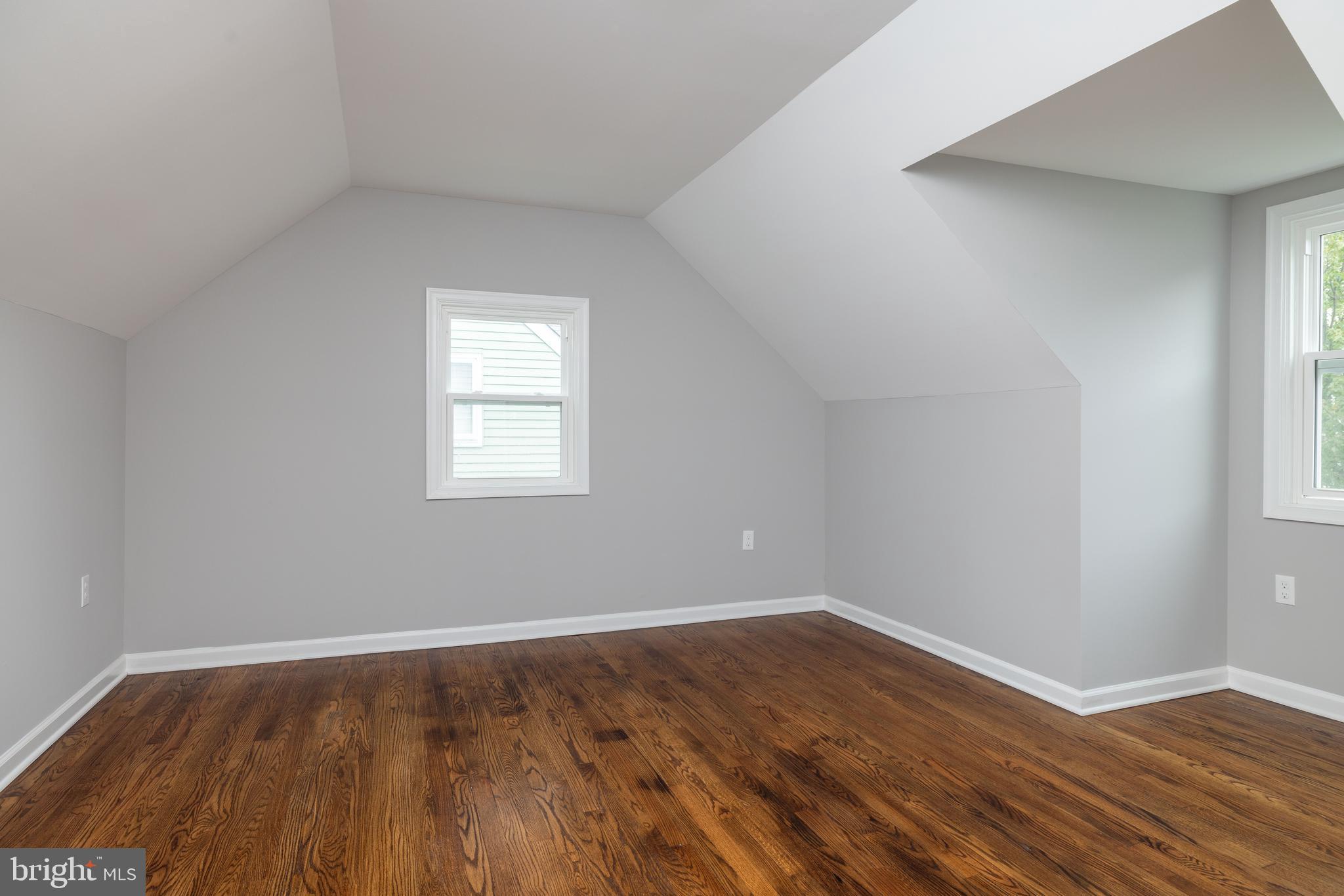 110 Old Point Road Wilmington, DE 19803 - Photo 14 of 27 an empty room with wooden floor and windows