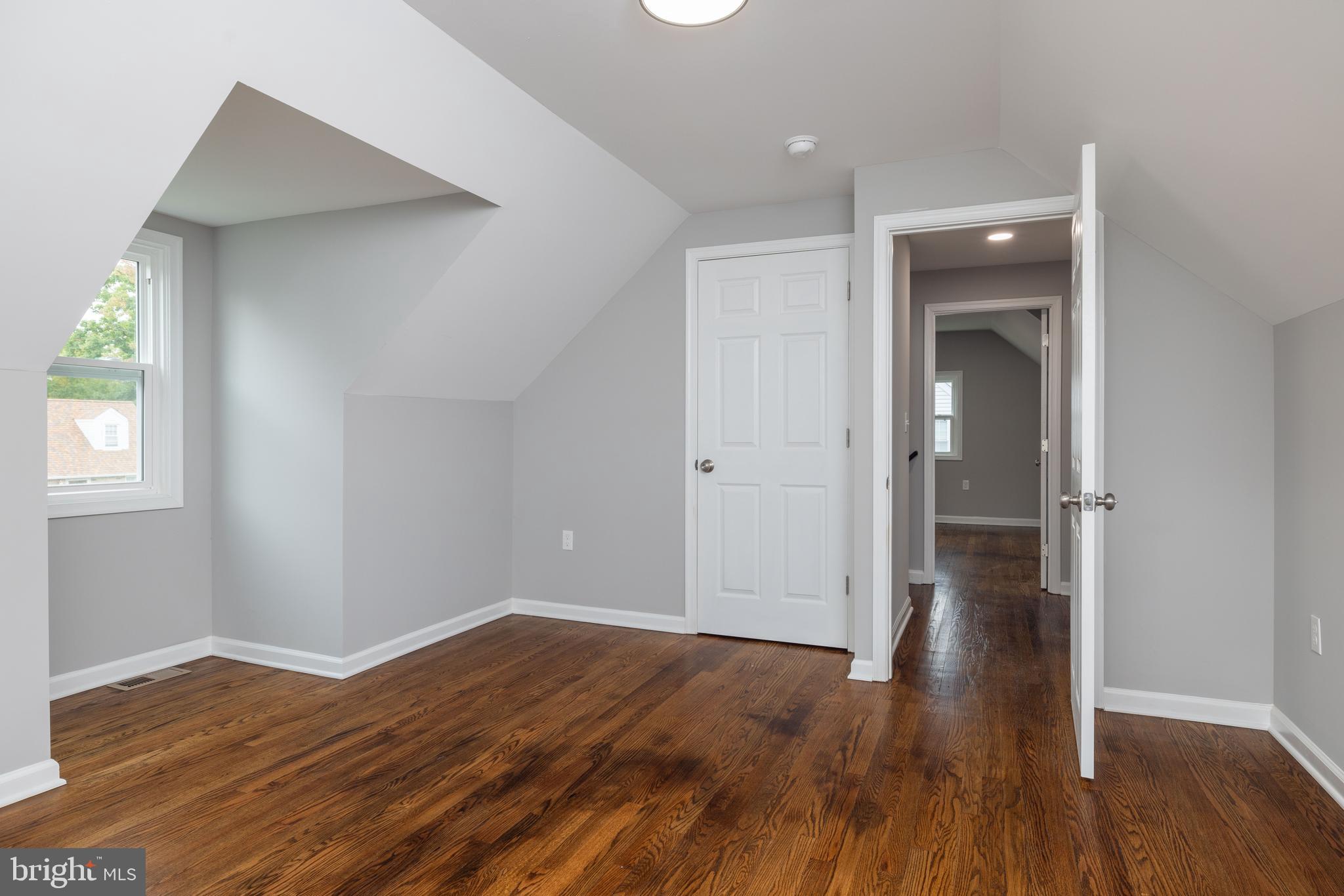 110 Old Point Road Wilmington, DE 19803 - Photo 15 of 27 wooden floor in an empty room with a window