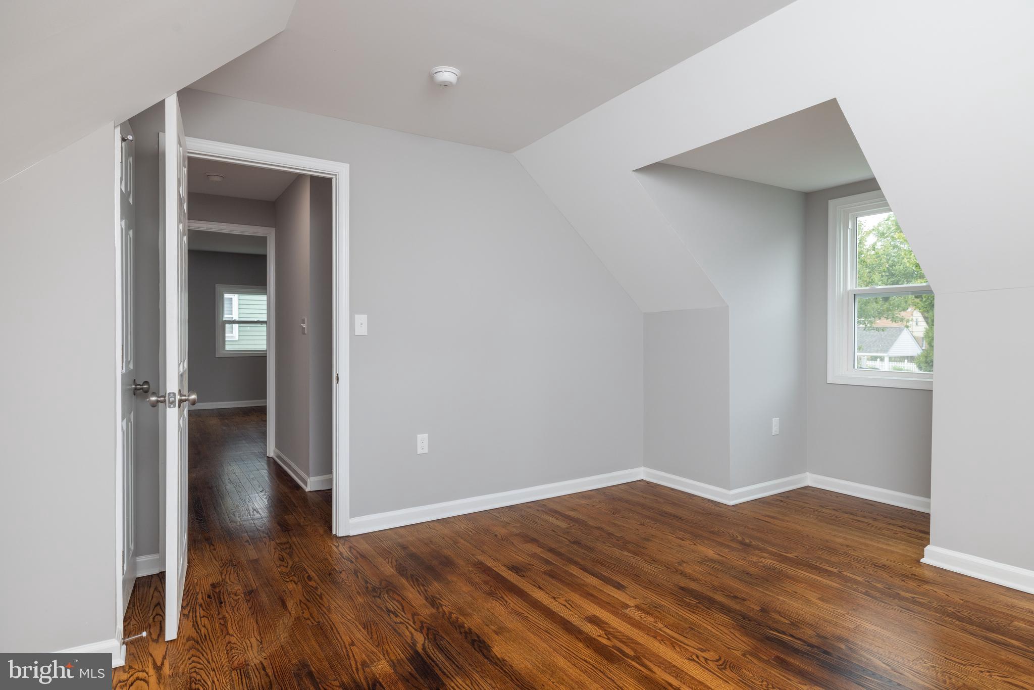 110 Old Point Road Wilmington, DE 19803 - Photo 18 of 27 an empty room with wooden floor closet and windows